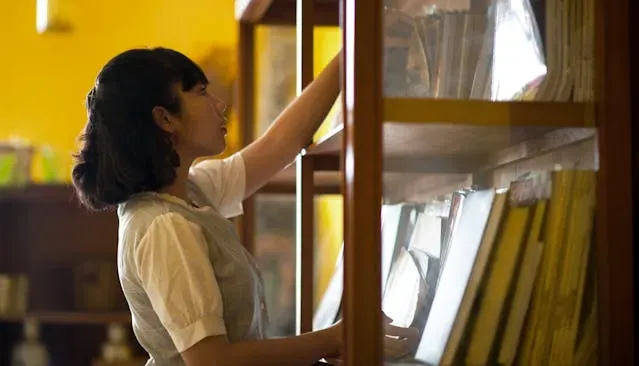 Woman browsing books in a bookshop